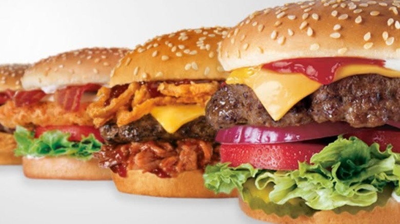 Carl's Jr. Six-Dollar Burgers lined up against a white background.