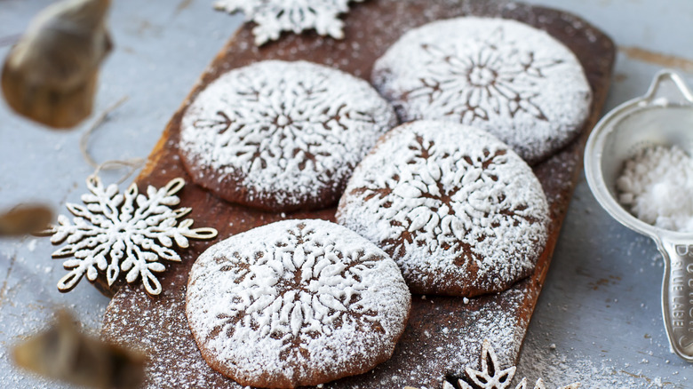 cookies with snowflake stencils and powdered sugar