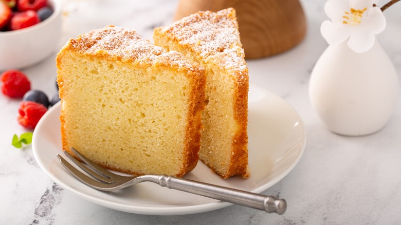 Two slices of pound cake on a white plate