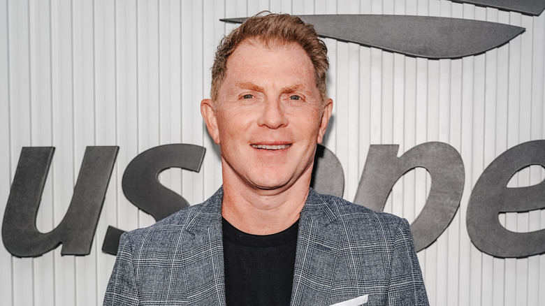 Bobby Flay smiles at the US Open.