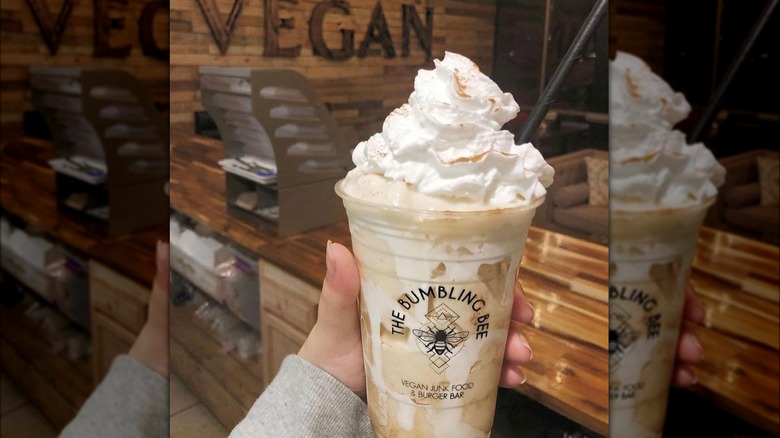 Person holding a milkshake