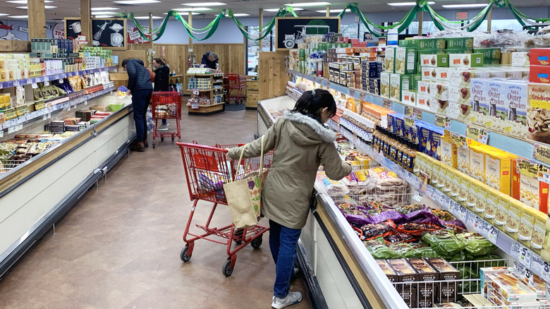 People shopping in the freezer section of Trader Joe's