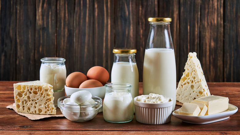 Eggs next to a variety of dairy products