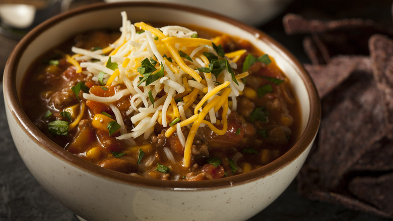 a bowl of homemade chili topped with shredded cheese