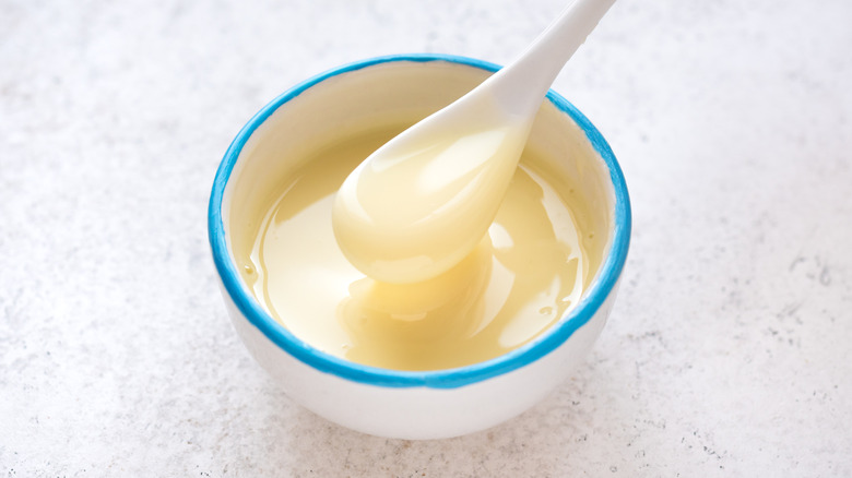 Sweetened condensed milk in white bowl