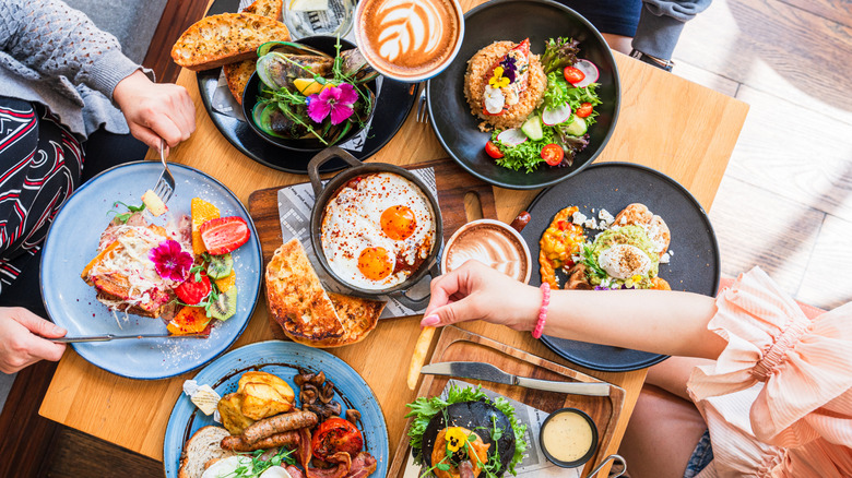 Top view of people enjoying aesthetic brunch.