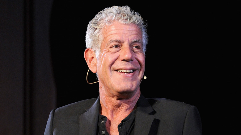Anthony Bourdain smiling on stage