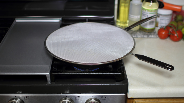 Cook using a splatter screen