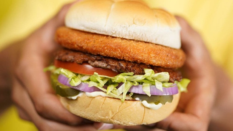 Hands holding Culver's CurderBurger