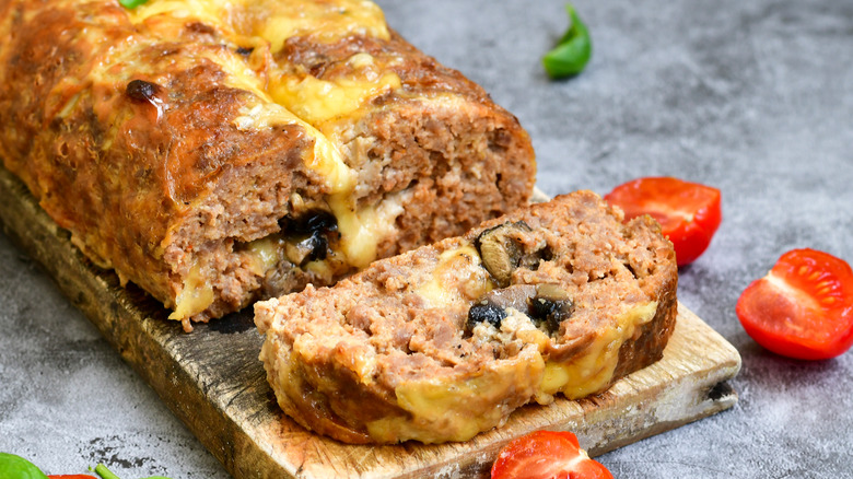 Homemade meatloaf topped with melted cheese