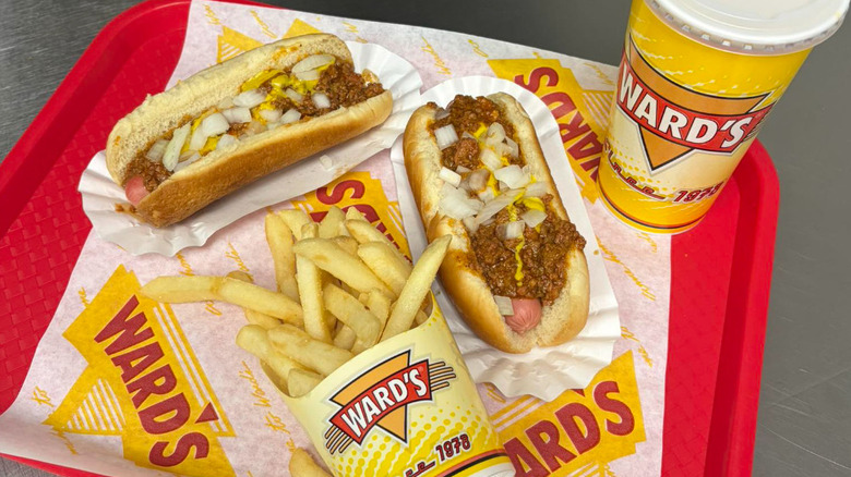 Two Ward's chili dogs with a drink and fries.