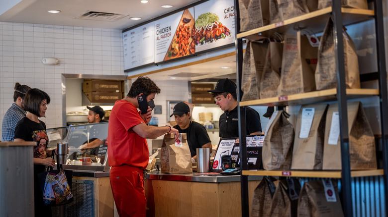 people picking up food at Chipotle 