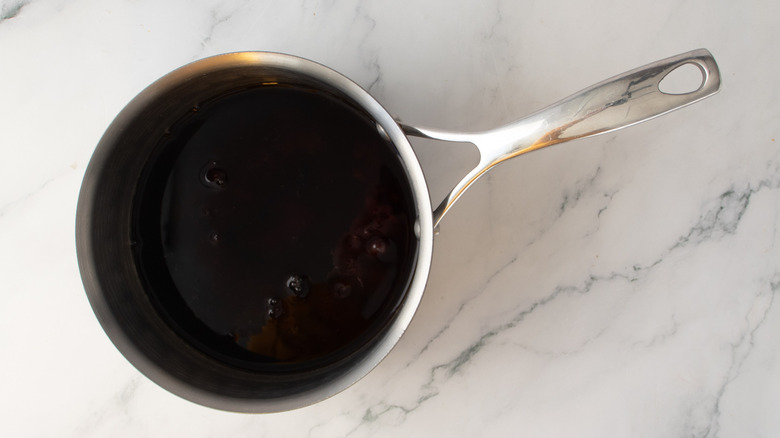 dark liquid in a metal pot