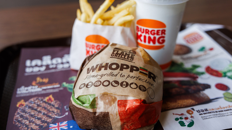 A Burger King Whopper meal with fries and a drink.