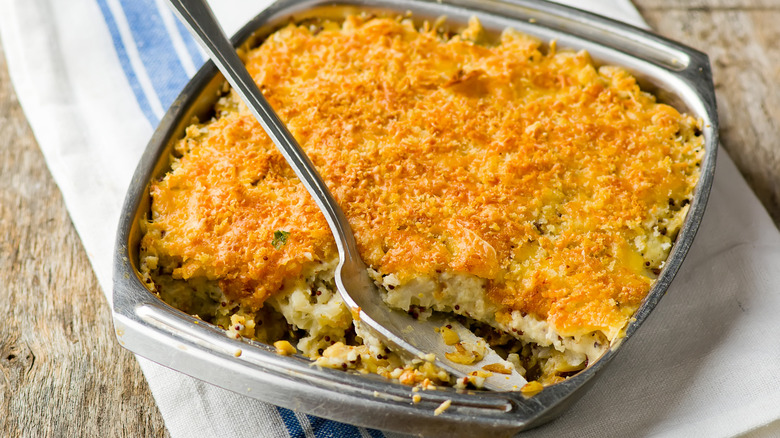 Hachis Parmentier served with a spoon.