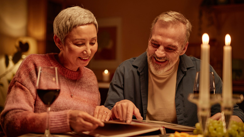 A smiling senior couple at dinner