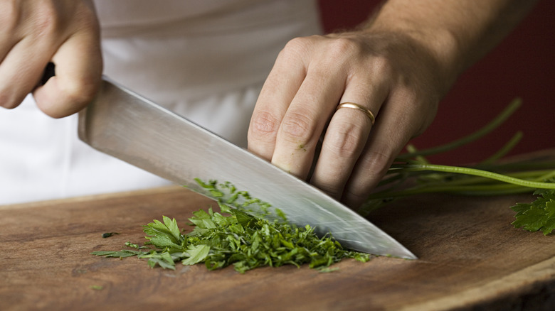 Chef using sharp kitchen knife 