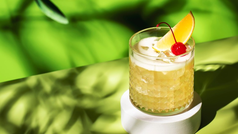 Whiskey sour with cherry garnish