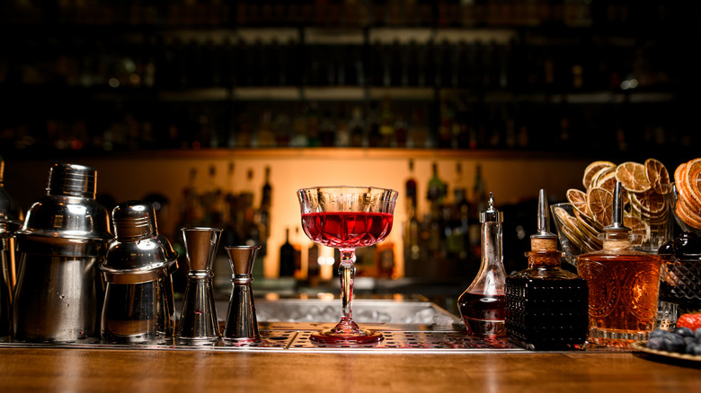 Red cocktail on bar 