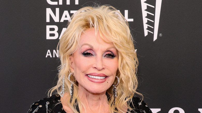 Dolly Parton smiles at an event.