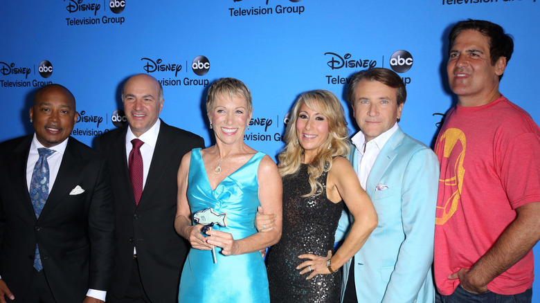 Shark Tank Cast on a Disney ABC red carpet all smile and pose