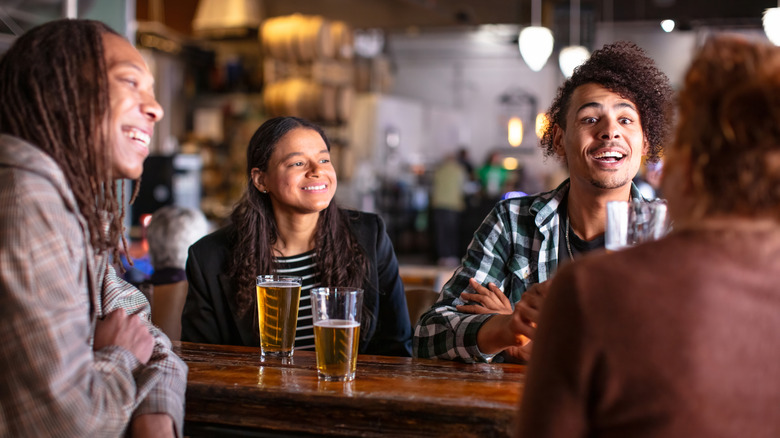 Friends drinking in a brewery.