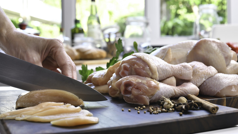 cook preparing chicken