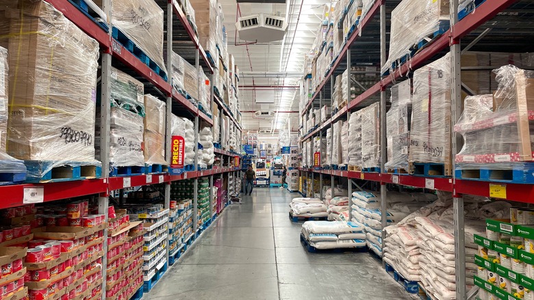 Many items sit on the tall shelves of a Sam's Club warehouse store