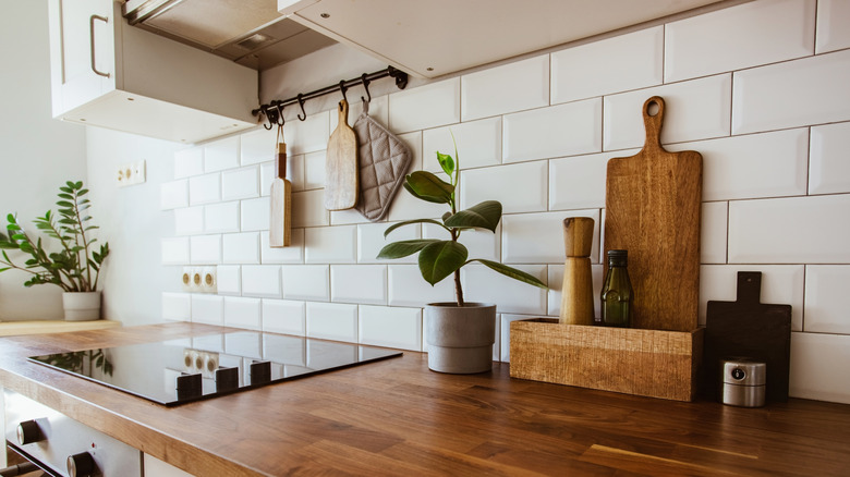 charcuterie board leaning on kitchen wall