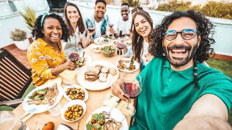 friends having family-style dinner