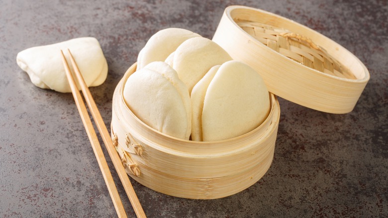 Bao buns in a bamboo steamer