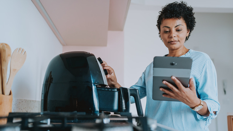 woman prepping air fryer