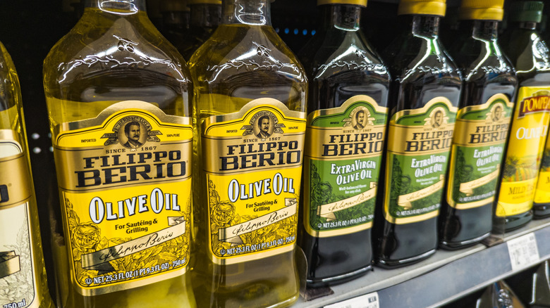 Bottles of Filippo Berio olive oil on grocery shelves