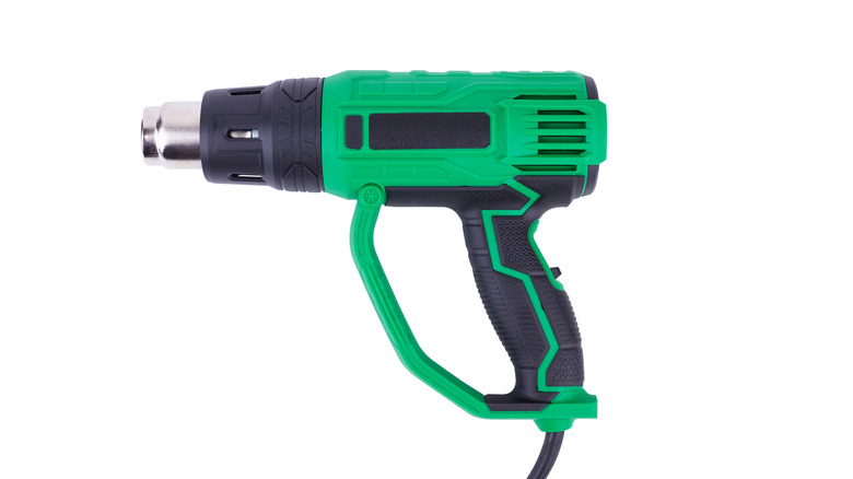 a green heat gun on a white background