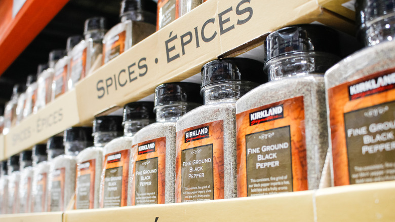 Kirkland Signature fine ground black pepper sits in its boxes on a store shelf.