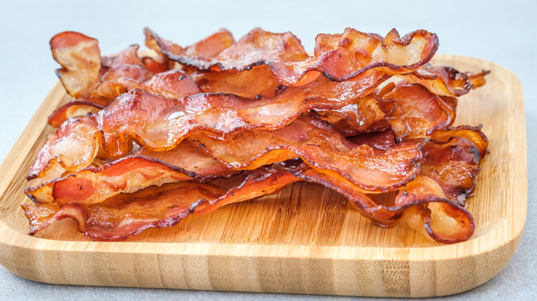 bacon strips on wooden board