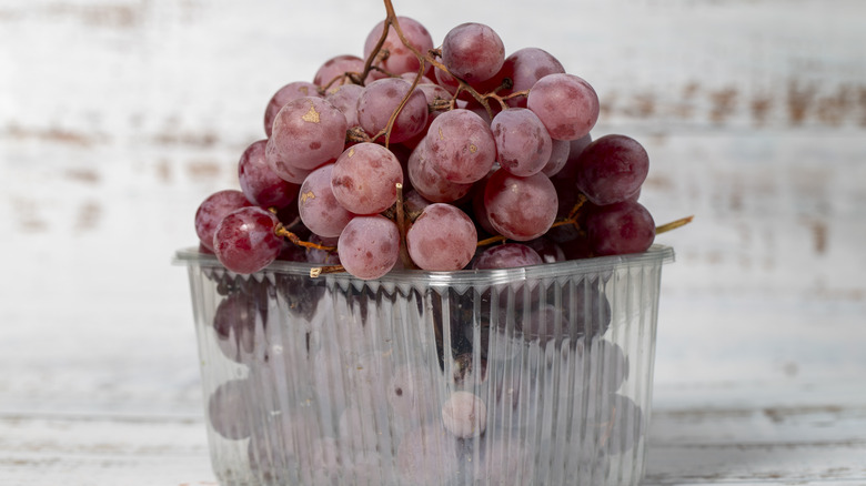 Red grapes in an open container
