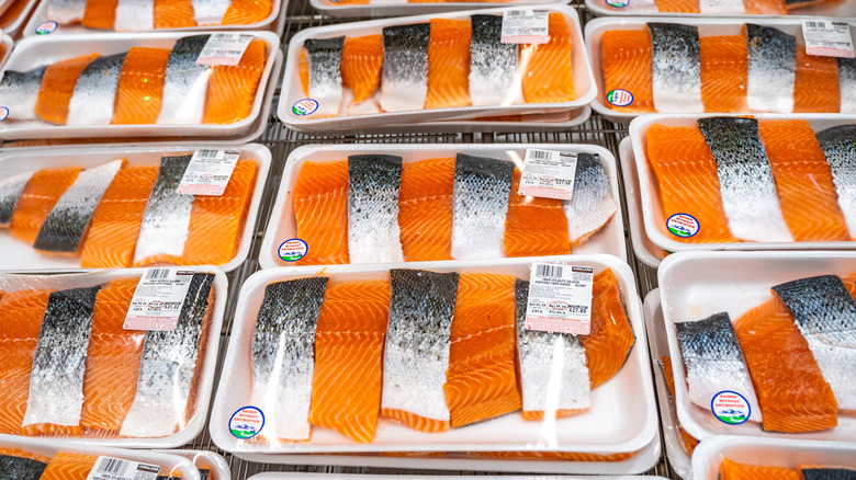 A refrigerator case with Kirkland fresh salmon at Costco