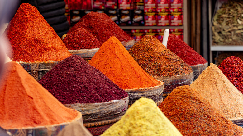 A spice market with heaping baskets full of spices