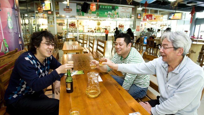 Friends sharing beer