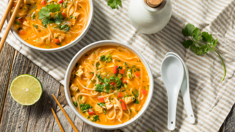 Two bowls of coconut curry pho.