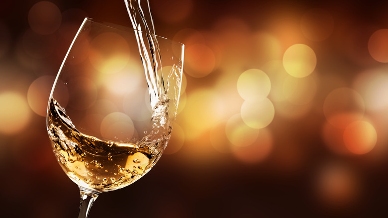 white wine being poured