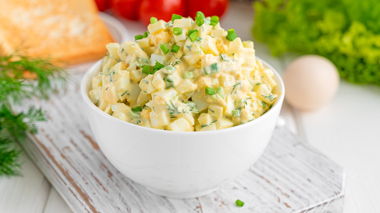 egg salad displayed on a white bowl