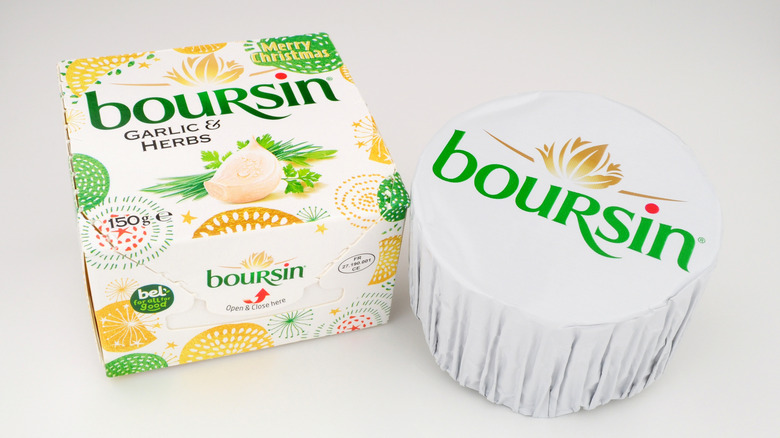 A box of Boursin next to a package of the creamy cheese