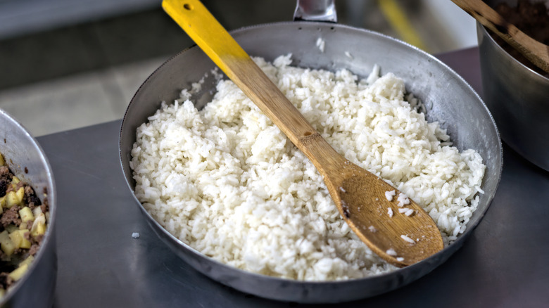 Rice is toasted in a pan