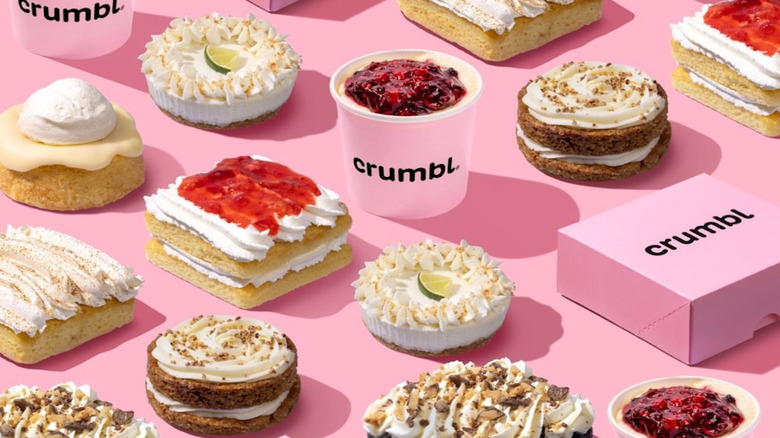 Crumbl boxes surrounded by various treats