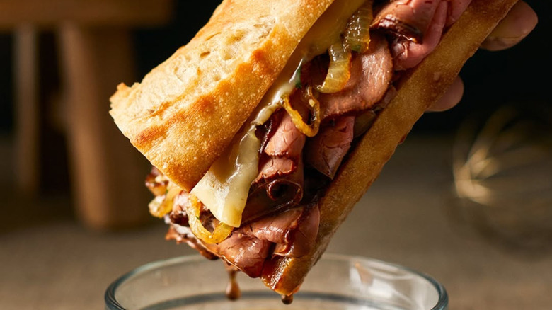 A roast beef sandwich made with Boar's Head roast beef dipped into au jus.