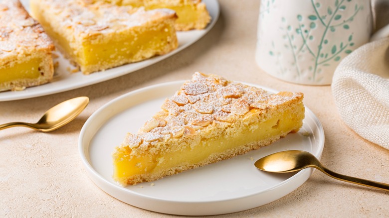 A slice of torta della nonna on a plate