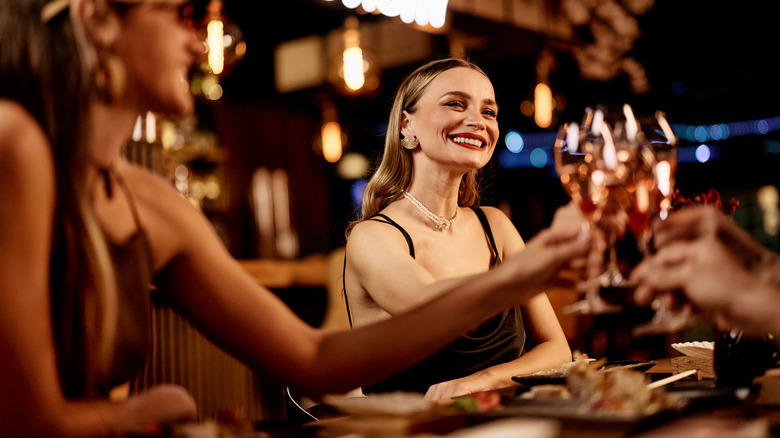 Diners toasting at a restaurant.