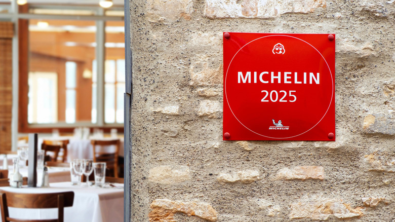 Michelin Guide star sign hanging on a wall.